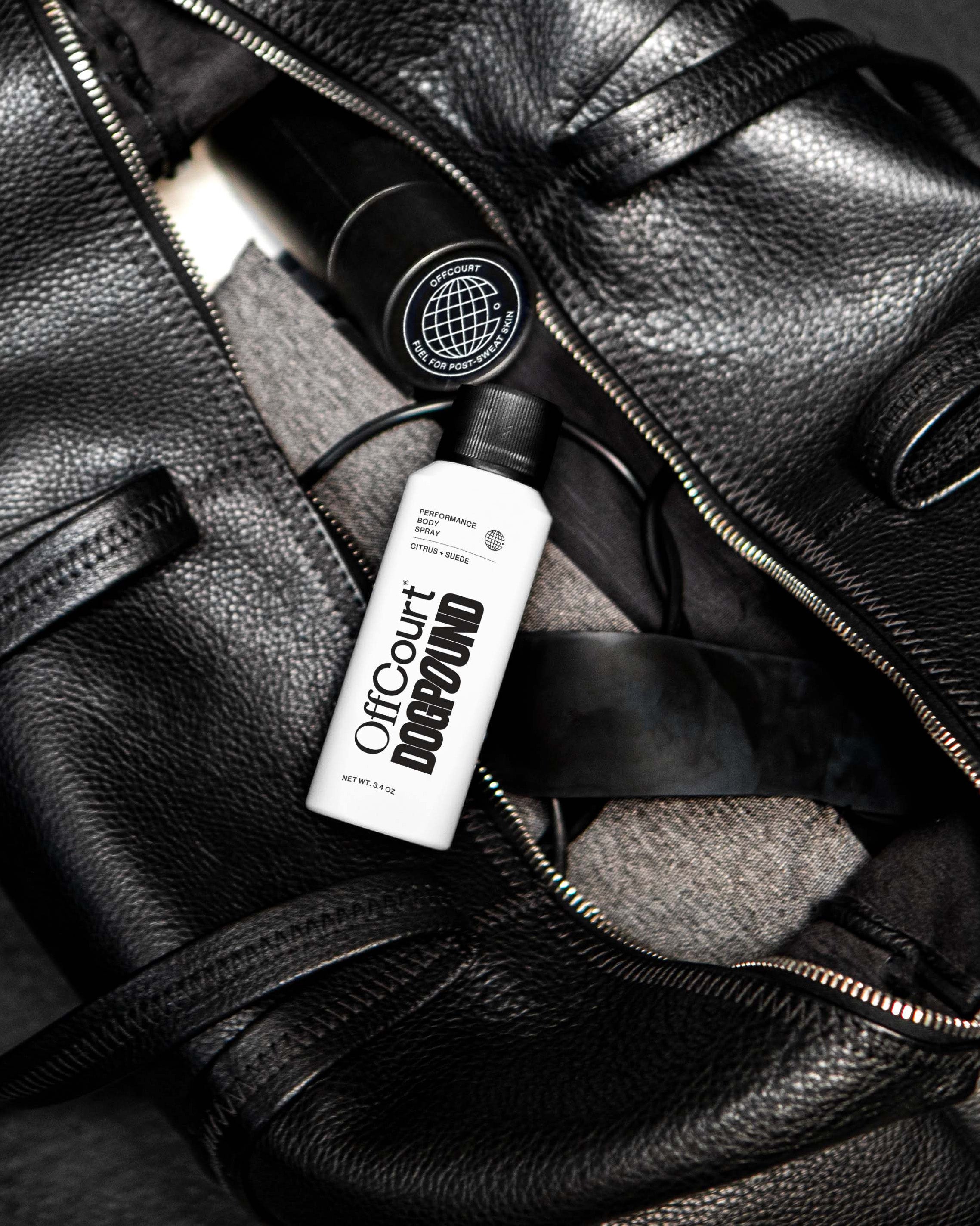 a can of body spray placed on a gym bag