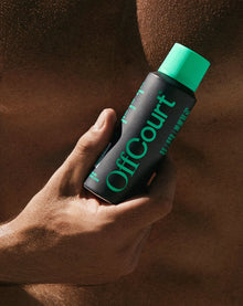 a man holding a can