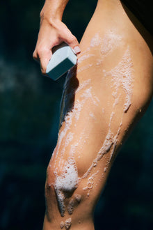 Woman holding a bar of soap