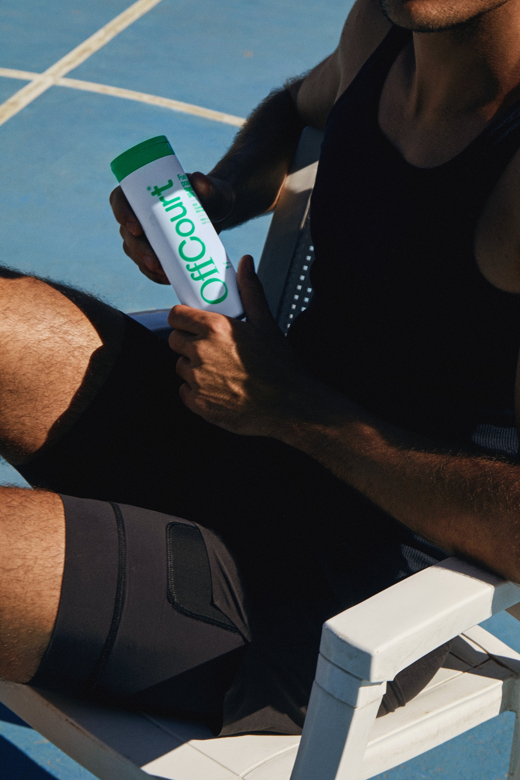 Man holding Deep Cleansing Body Wash in Fresh Citron + Driftwood fragrance