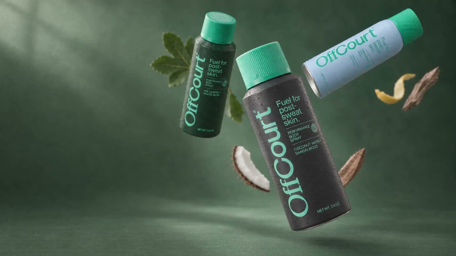Three OffCourt body sprays floating among fresh fragrance ingredients