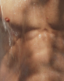 A man using the soap on his body 