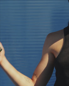 Woman spraying a fragrance 