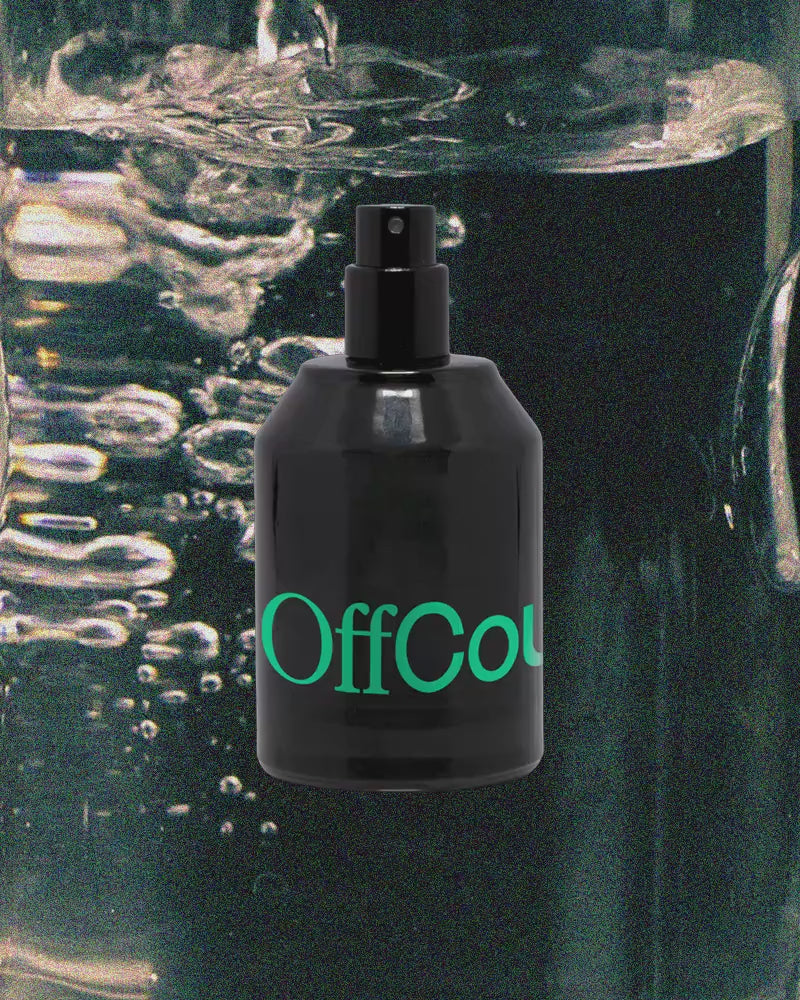 Fragrance bottle with moving images of ingredients: Sandalwood, Coconut water, Black pepper