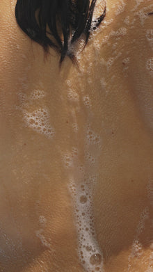A woman using soap 